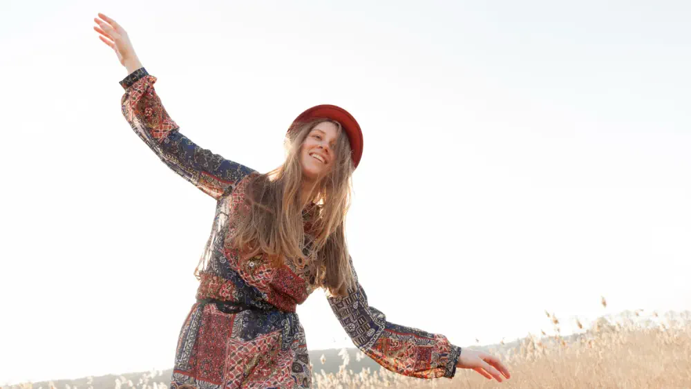 Woman outdoors representing symptom relief.