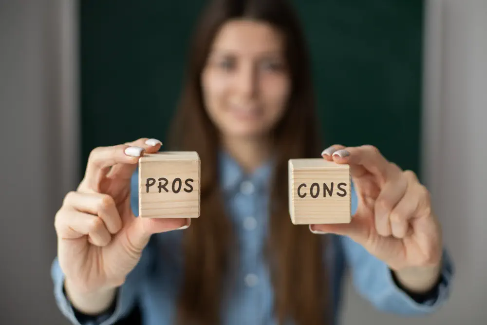 A woman holding "PROS" and "CONS" blocks, representing Contemplation stage ambivalence.