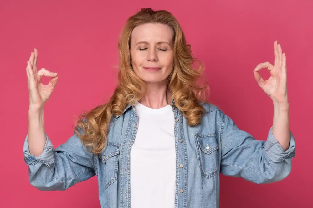 A woman meditating, representing the mental stages of change.